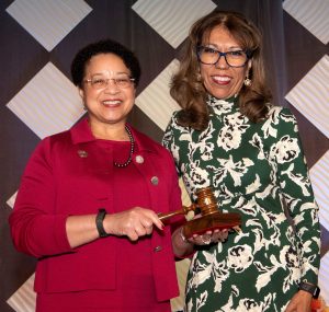 Heidi Anderson receives the gavel from Cynthia Teniente-Matson