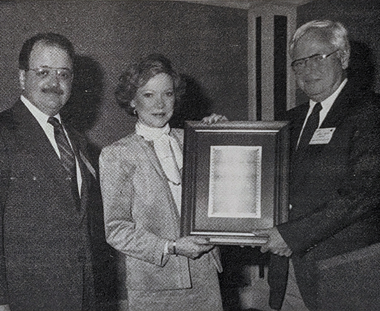 Rosalynn Carter receives the DAA in 1987 from Hoke Smith and William H. Capitan, president of Georgia Southwestern College.