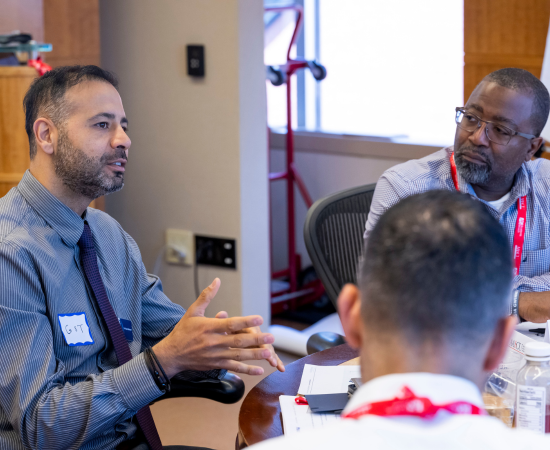 HusamAlshareef chats with ELP colleagues.